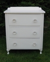 A classic-shaped bedside cabinet with glass knobs - SOLD
